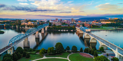 Aerial view of bridges crossing water leading into downtown Chattanooga, TN