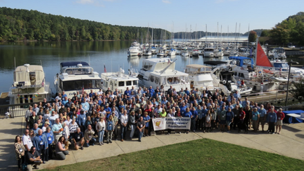 Group Shot of Loopers at Rendezvous in Front of Docked Boats